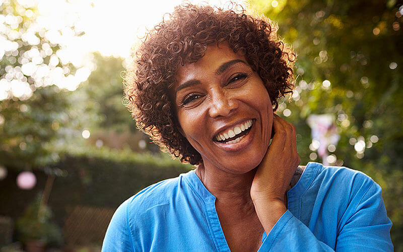 Woman smiling after Glaucoma treatment