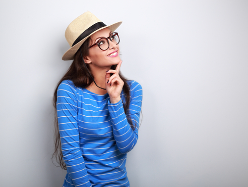 Young woman with glasses considering LASIK