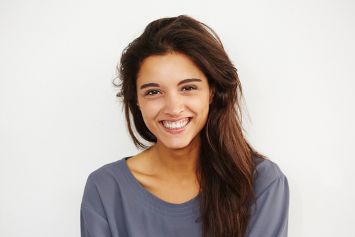 Young woman smiling after LASIK eye surgery