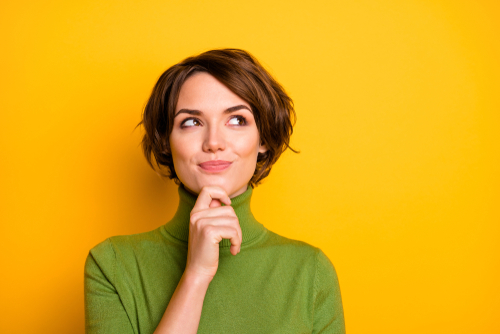 woman in green turtleneck 