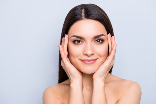 woman with her hands around her face