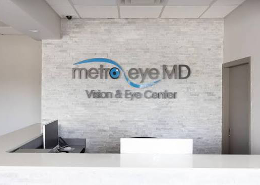 Bayside front desk with the Metro Eye MD Vision and Eye Center sign